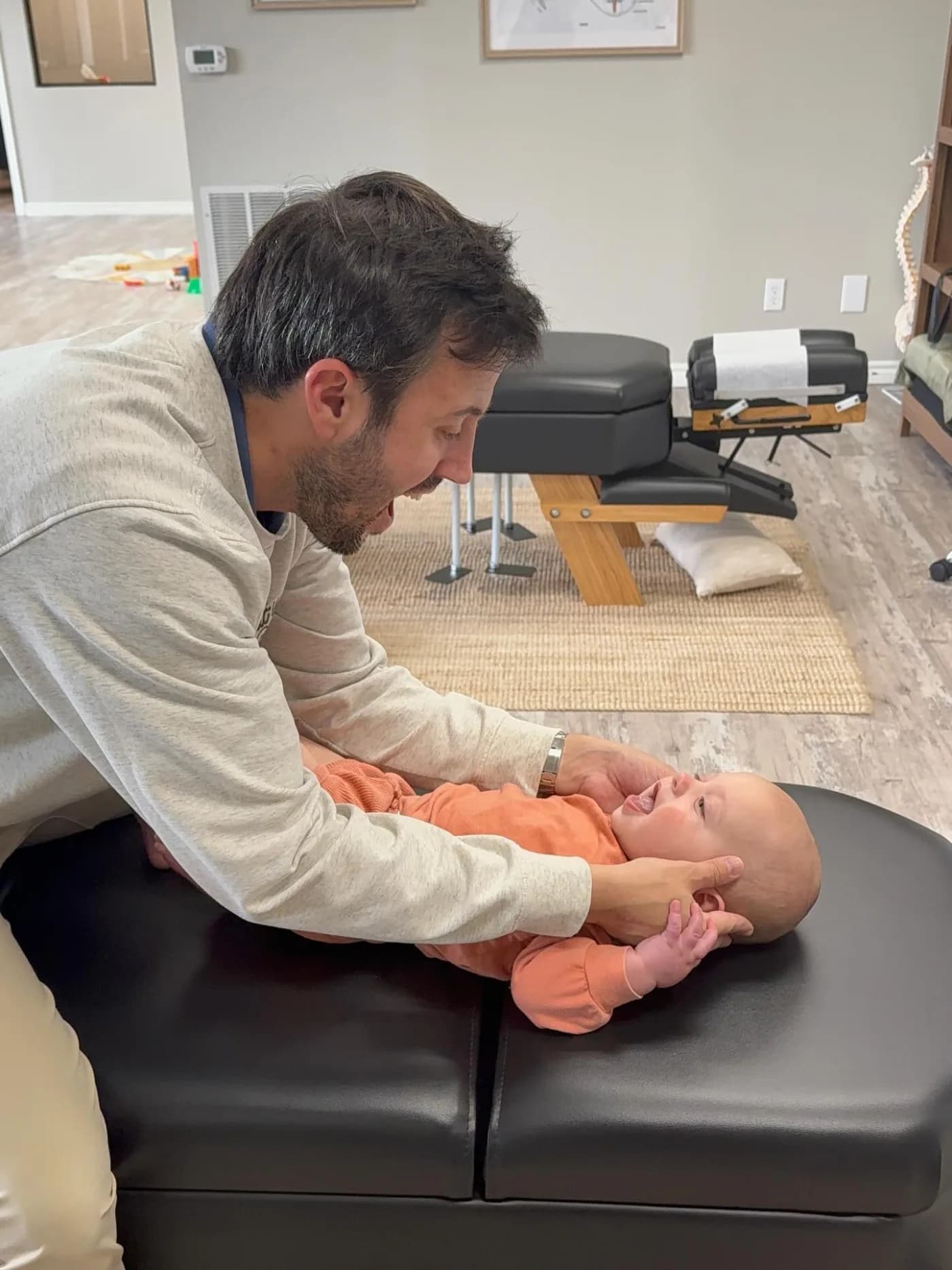 Smiling baby with Dr. O'Brien